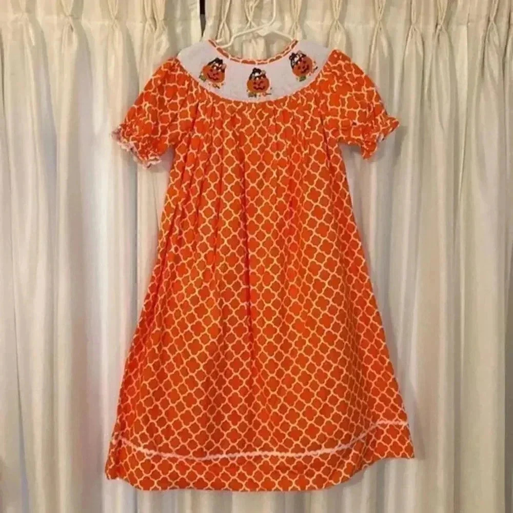 Girls smocked Fall/Halloween dress is precious, timeless and a vibrant stand out
